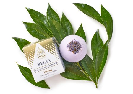 Image of Relax CBD Activated Bath Fizz Atop a Botanical